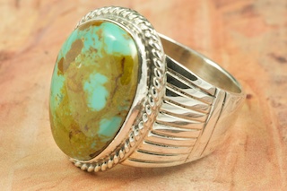 Genuine Manassa Turquoise set in Sterling Silver Ring. This Turquoise is also referred to as King�s Manassa Turquoise. The Manassa Turquoise mine is located in Manassa, Conejos County, Colorado. Created by Navajo Artist Thomas Chischilly. Signed.